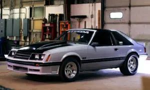 Gray and black two door Fox Body Mustang