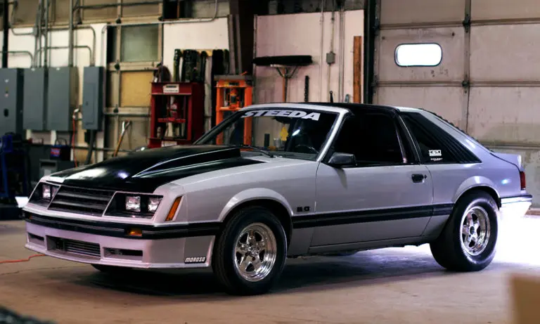 Gray and black two door Fox Body Mustang