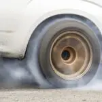 B body car doing a burn out at the track