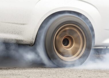 B body car doing a burn out at the track
